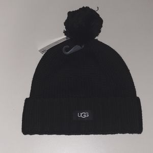 UGG Black cuff hat with yarn pom pom.